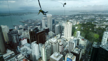 Bungee jump from the Sky Tower in Auckland New Zealand photo via Depositphotos