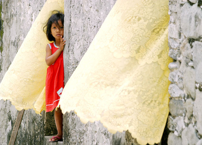 Exploring the Philippines: A Travel Guide to Hidden Gems, Culture, and Coastal Escapes Ivatan Kid in Sabtang Island by Roger Alcantara