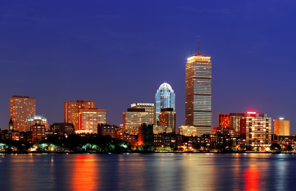 Boston city skyline at dusk with Prudential Tower and urban skys