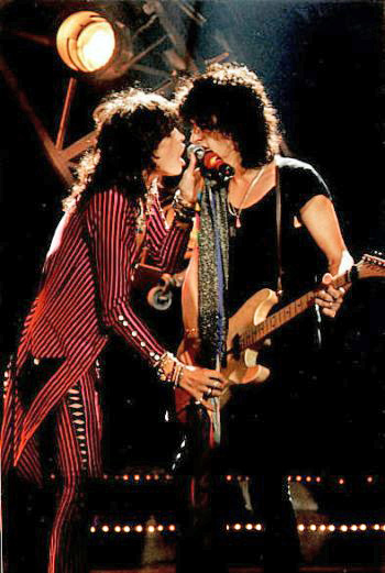 Steven Tyler and Joe Perry performing live in concert.
