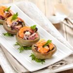 Artichoke hearts stuffed with seafood.