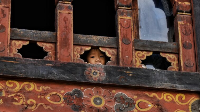 Kid in Bhutan photo by Atharva Whaval via Unsplash
