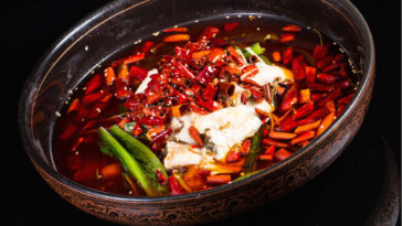 Szechuan braised fish with golden mushrooms and spicy broth