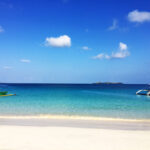 Cal means lime and agua/s is water in Spanish. It is apt if you look at the clear and azure waters of this place.