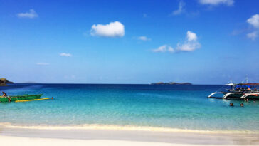 Cal means lime and agua/s is water in Spanish. It is apt if you look at the clear and azure waters of this place.