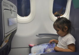 On her seat, prior to take-off