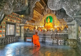 A praying Monk inside Wat Srisuphan