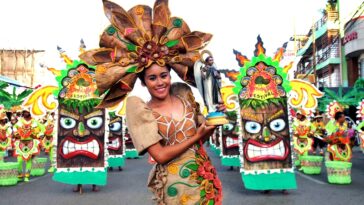 Performers donned eye-catching costumes highlighted by their beautiful smiles - Photo by Teddy Pelaez