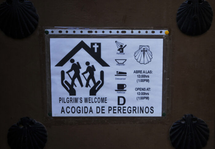 Typical notice on an entrance door of a pilgrims inn, the albergue.