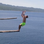 A commencing back-flip from the 9-meter board
