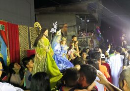 People are lining up to get closer to the image of the patron saint