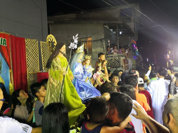 People are lining up to get closer to the image of the patron saint