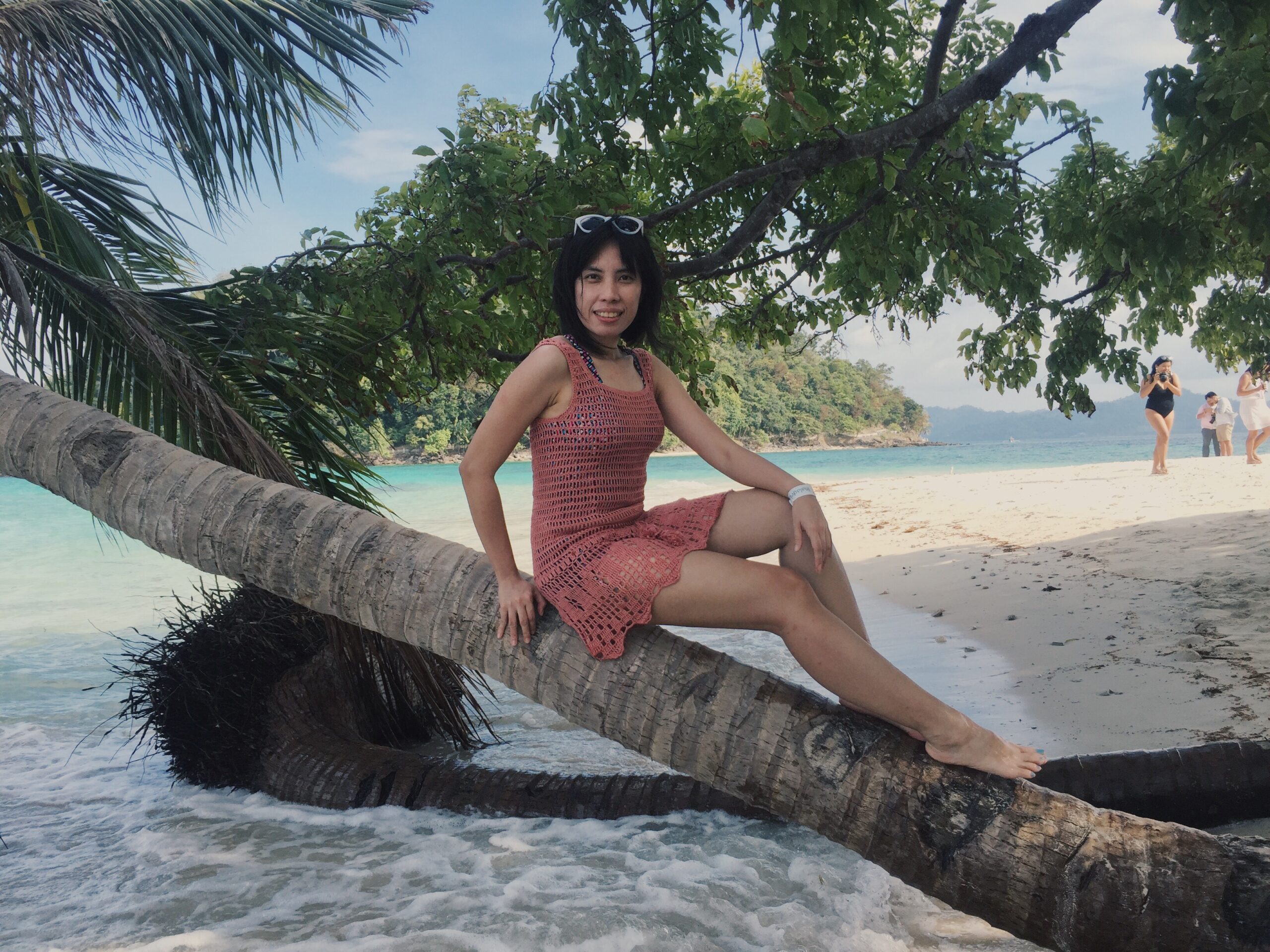 The lovely Ms. Frances of Inquirer posing at the bent over coconut tree in Inaladelan