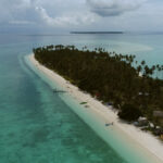 The Panampangan Island, known as the longest sandbar in the Philippines, with its sand dollar bounty and palm trees, sings its own beauty in its blue waters.