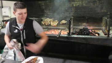 Action shot of the young chef (barely) grilling our steaks