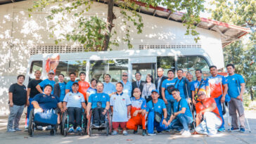 PPC officials, athletes and coaching staff together with TMP officials during the turnover of the Toyota Coaster donated by TMP to support the Paralympic movement in the Philippines.