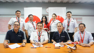 Philippines AirAsia Inc. and Omni Aviation Corporation sign partnership for the Cadet Pilot Program on Wednesday, July 24. Standing L-R: Capt. Christopher Natividad, Chief Pilot for Flight Safety; FO Nicholas Serrano, Quality Assurance Manager; AirAsia Cabin Crew; Capt. Jasmine Timola and FO Bruce Melvin Tan, Line Pilots. Seated L-R: Capt. Eleazar Cayago, Omni Aviations Head of Training; Capt. Dexter Comendador, Philippines AirAsia CEO; Mr. Steven Virata, Omni Aviations COO; Capt. Nilo Oropesa, Chief Pilot for Operations.