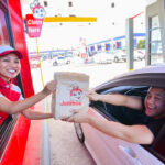 Another satisfied customer joyfully passing through the country’s 1st Dual Lane Drive Thru.