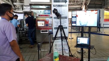 LRT-1 Security watches entering passengers on a thermographic monitor