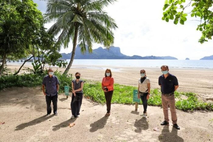 L-R Palawan Governor Jose Alvarez, Tourism Secretary Bernadette Romulo-Puyat, El Nido Mayor Edna Lim, Tourism Promotions Board COO Maria Anthonette Velasco-Allones, and Ten Knots Development Corporation COO Javier Hernandez in front of the El Nido backdrop after the site inspection