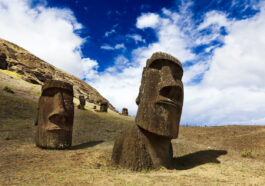 Heads of buried moais standing on a mountain in Easter Island photo via DepositPhotos