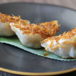 Pan-fried Minced Pork Chive Dumplings topped with Sakura Shrimp