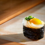 Chef Makoto’s specialty sushis include fresh and sweet squid Ika and Quail Egg Yolk Sushi