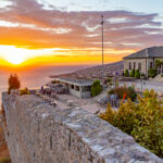Sunset view of courtyard of Lekuresi castle at Sarande, Albania photo via Depositphotos