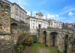 Bridge and the gate Porta San Giacomo in Bergamo, Italy on the Venetian Walls photo via Depositphotos
