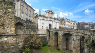 Bridge and the gate Porta San Giacomo in Bergamo, Italy on the Venetian Walls photo via Depositphotos