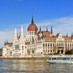 Danube River with Budapest Parliament as a backdrop photo via Depositphotos