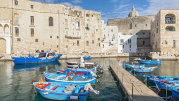 View of Monopoli harbor with fishing boats, Apulia, Italy. photo via Depositphotos