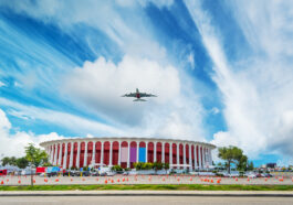 Airplane flying over Great Western Forum photo via Depositphotos