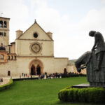 St. Francis astride his horse with head bowed after hearing the voice of God telling him to leave the war and return home.