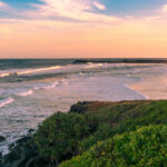 The beach view with pinky sunset in summer time on the beach in Ballina, Byron bay, Australia photo via Depositphotos