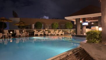 Quest Hotel's pool and bar