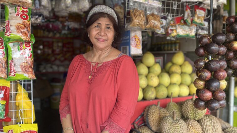 Marilyn and some of the fruits she sells.