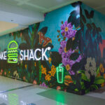 Shake Shack SM North Edsa’s hoarding featuring Raxenne Maniquiz’s interpretation of Philippine flora and fauna