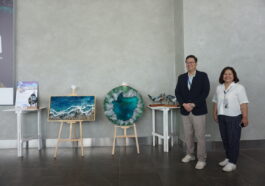 LIPAD President and CEO Noel F. Manankil and Corporate Communication Head Teri Flores with the art pieces of Justine Velasquez