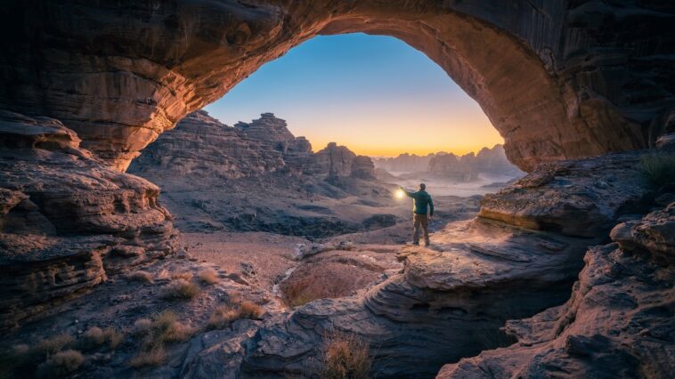 Natural rock bridge in the Hisma Desert – NEOM, Saudi Arabia via Unsplash