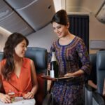 Singapore Airlines Premium Economy Serving Champagne
