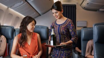 Singapore Airlines Premium Economy Serving Champagne