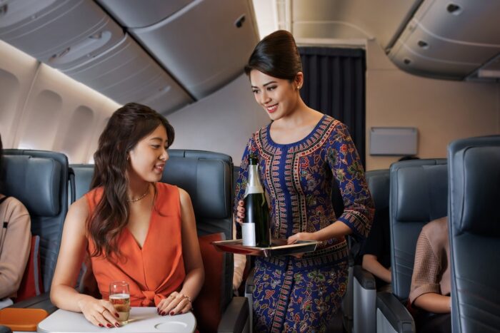 Singapore Airlines Premium Economy Serving Champagne