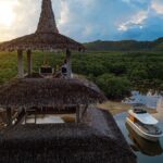 Visitors enjoy the view of the river, the mangroves, and the hills at the top of the three-floor tower in Nay Palad Hideaway in Siargao. Photo from the website of Nay Palad Hideaway