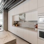 This residential project by Carol Peña features a Nolte kitchen designed for maximum functionality in an open-plan space while maintaining a clean, minimalist aesthetic.