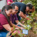 Megaworld Hotels & Resorts representatives planting some Sampaguita seedlings near Project PEARLS Learning Center.