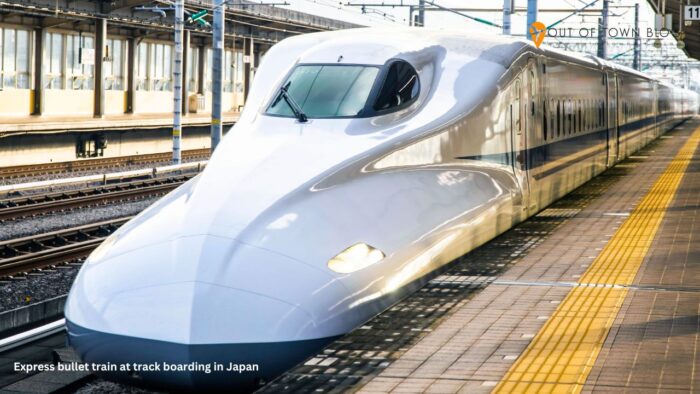 Express bullet train at track boarding in Japan