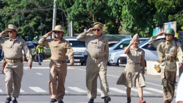 Historical reenactors saluting the remaining World War 2 veterans at the main commemoration day