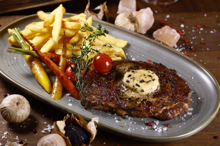 Black Garlic Dry Aged Black Angus Ribeye with sides