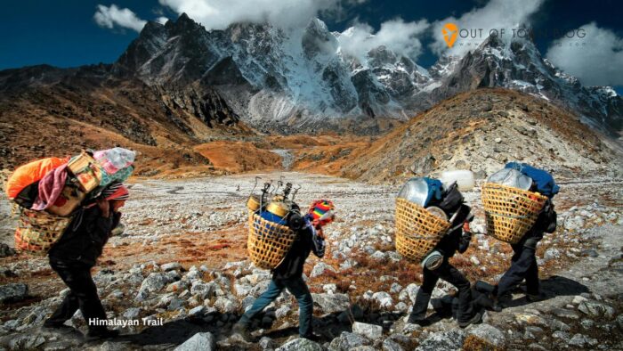Himalayan Porters Trekking in Nepal Mountains